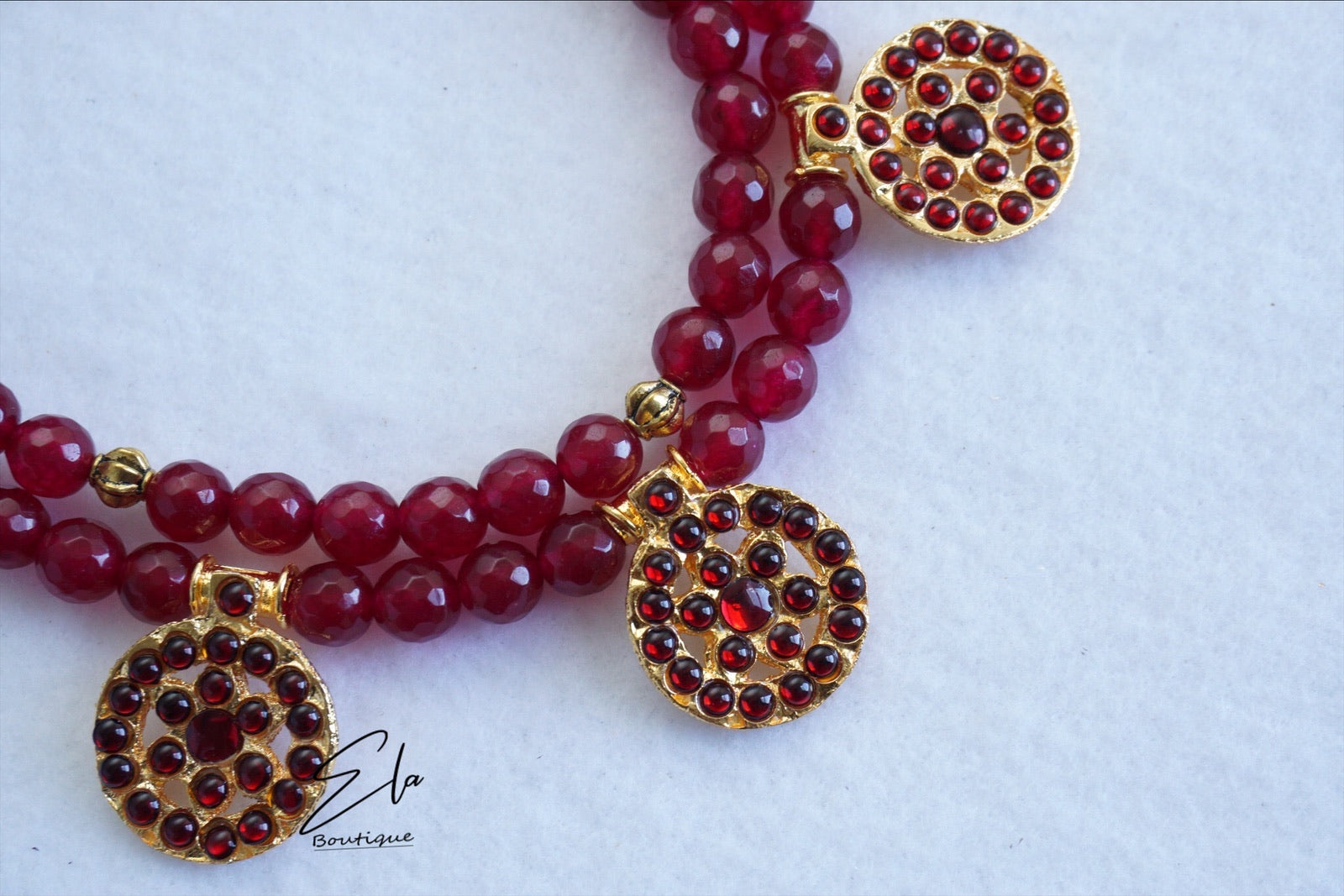 Traditional Kemp Neckwear with Red Beads.